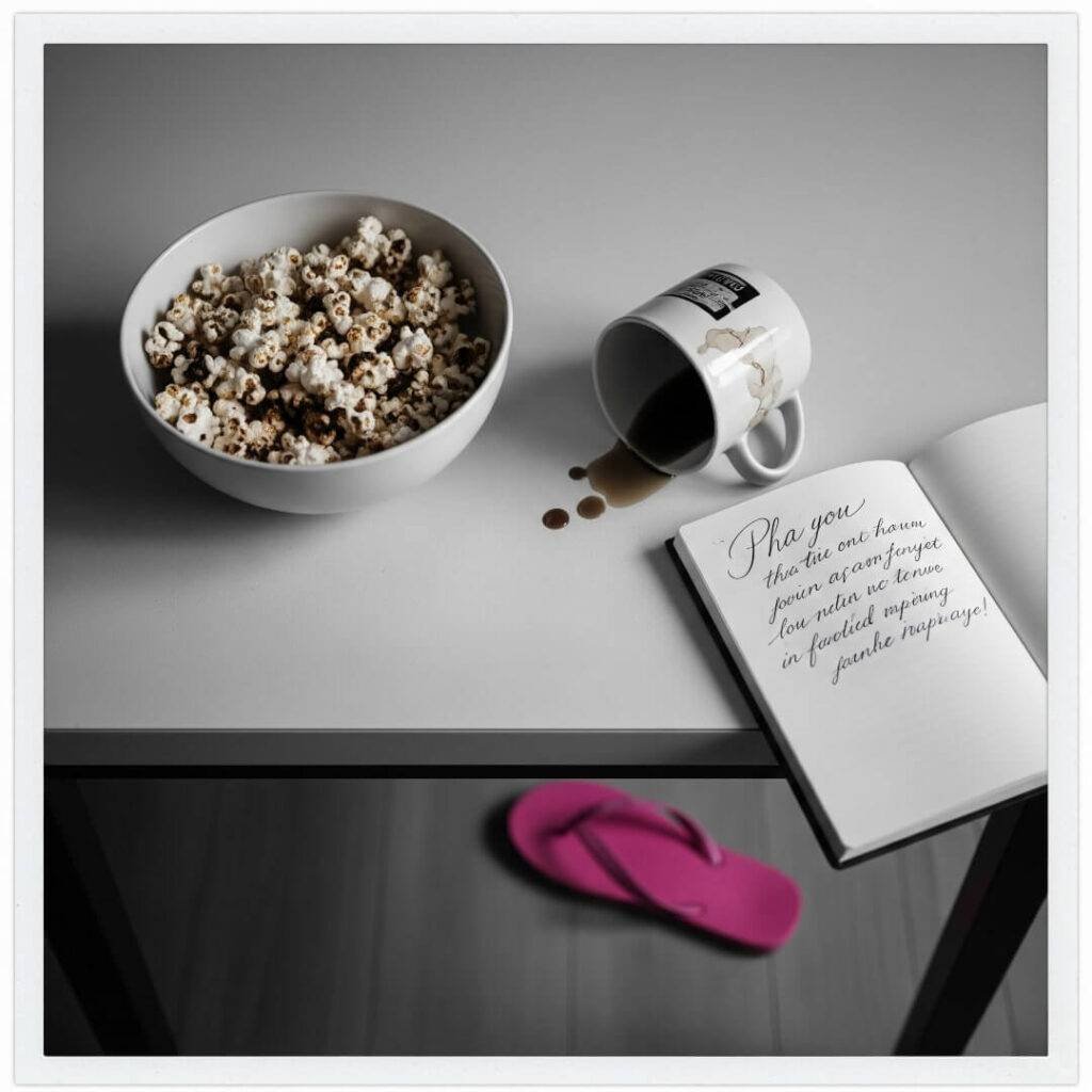 A kitchen counter with burnt popcorn, a spilled coffee mug