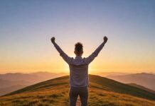 Growth Mindset Activities to Boost Your Confidence Triumphant figure on hill at sunrise.