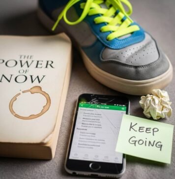 Real-Life Stories That Prove Self-Improvement Works A self-help book, scuffed sneaker, cracked phone with a to-do list